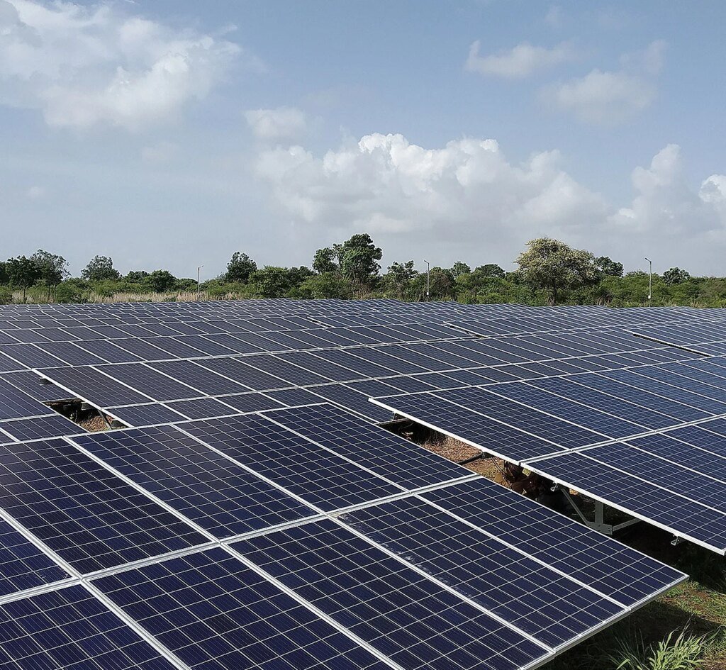 Solar panels being fitted on a roof in a close-up image.